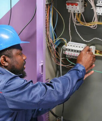 depositphotos_328265542-stock-photo-african-american-electrician-performing-wiring